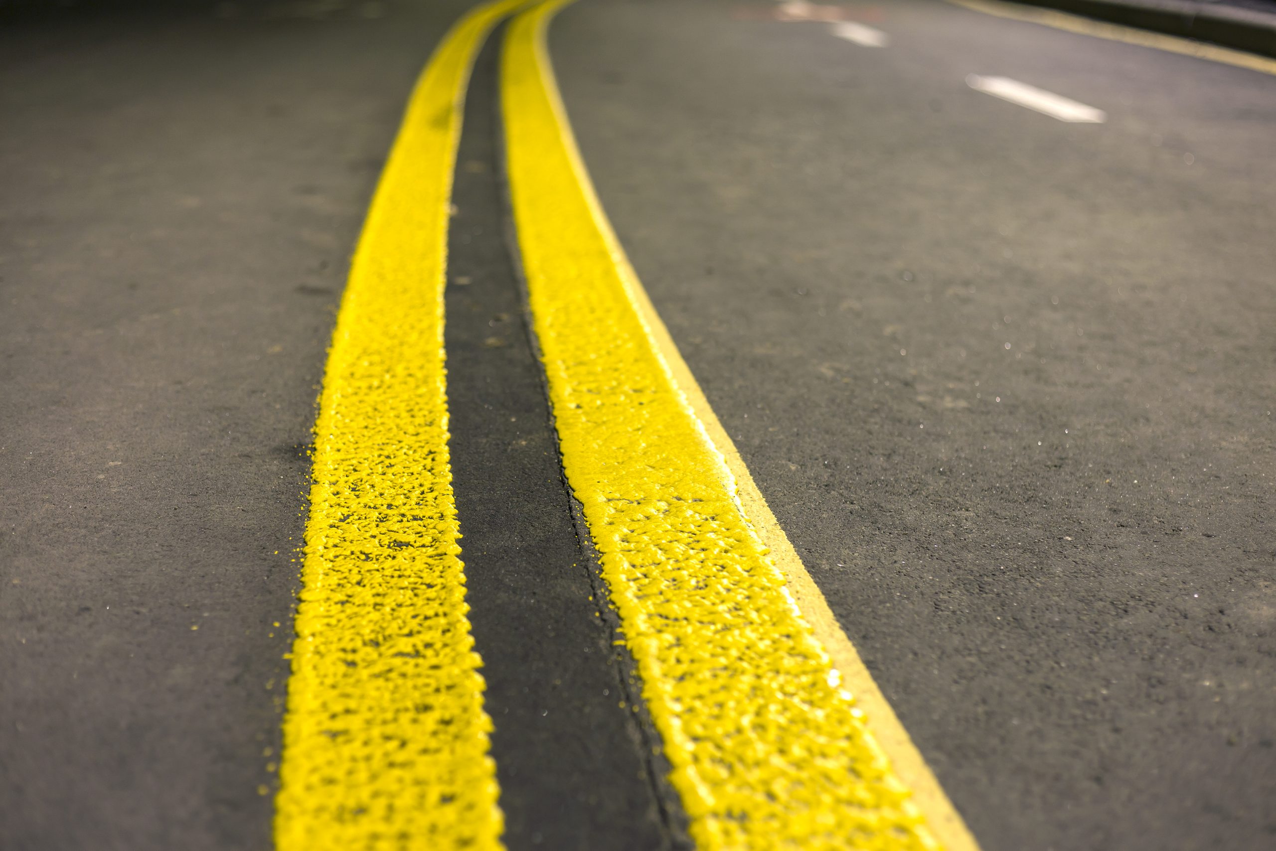 Yellow double stripes on paved road